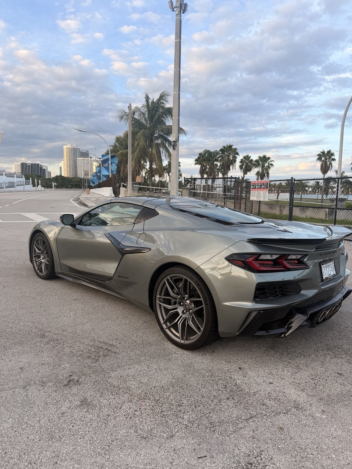 Corvette Z06 rear three-quarter view with quad exhaust and rear spoiler